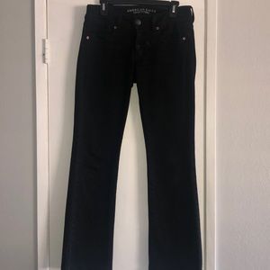 Black American Eagle “Kick Boot” jeans.